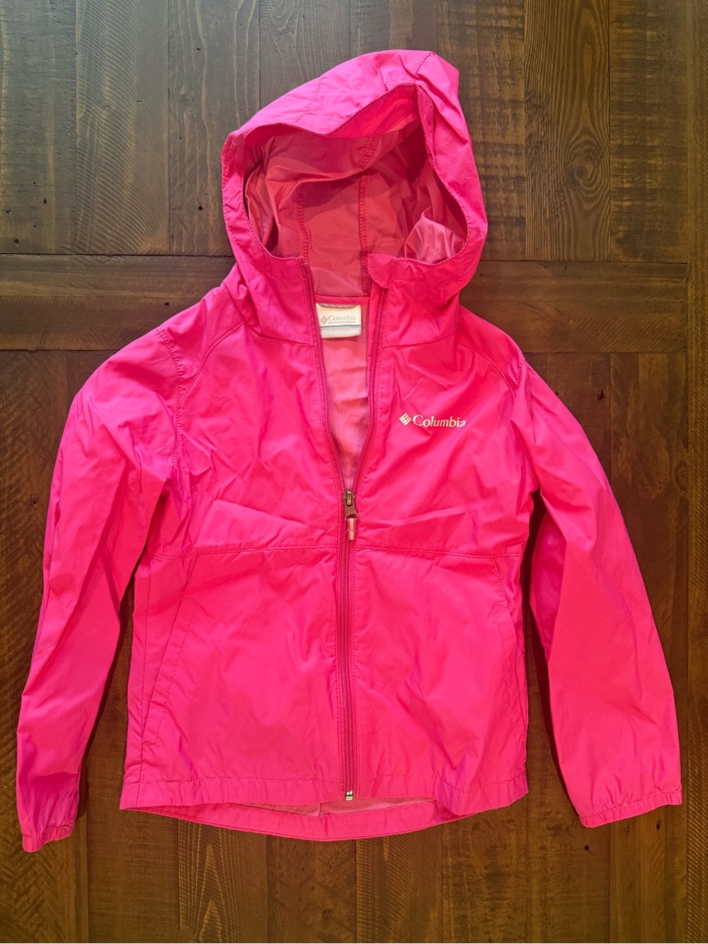 Columbia Kids' Hot Pink Hooded light weight rain jacket.